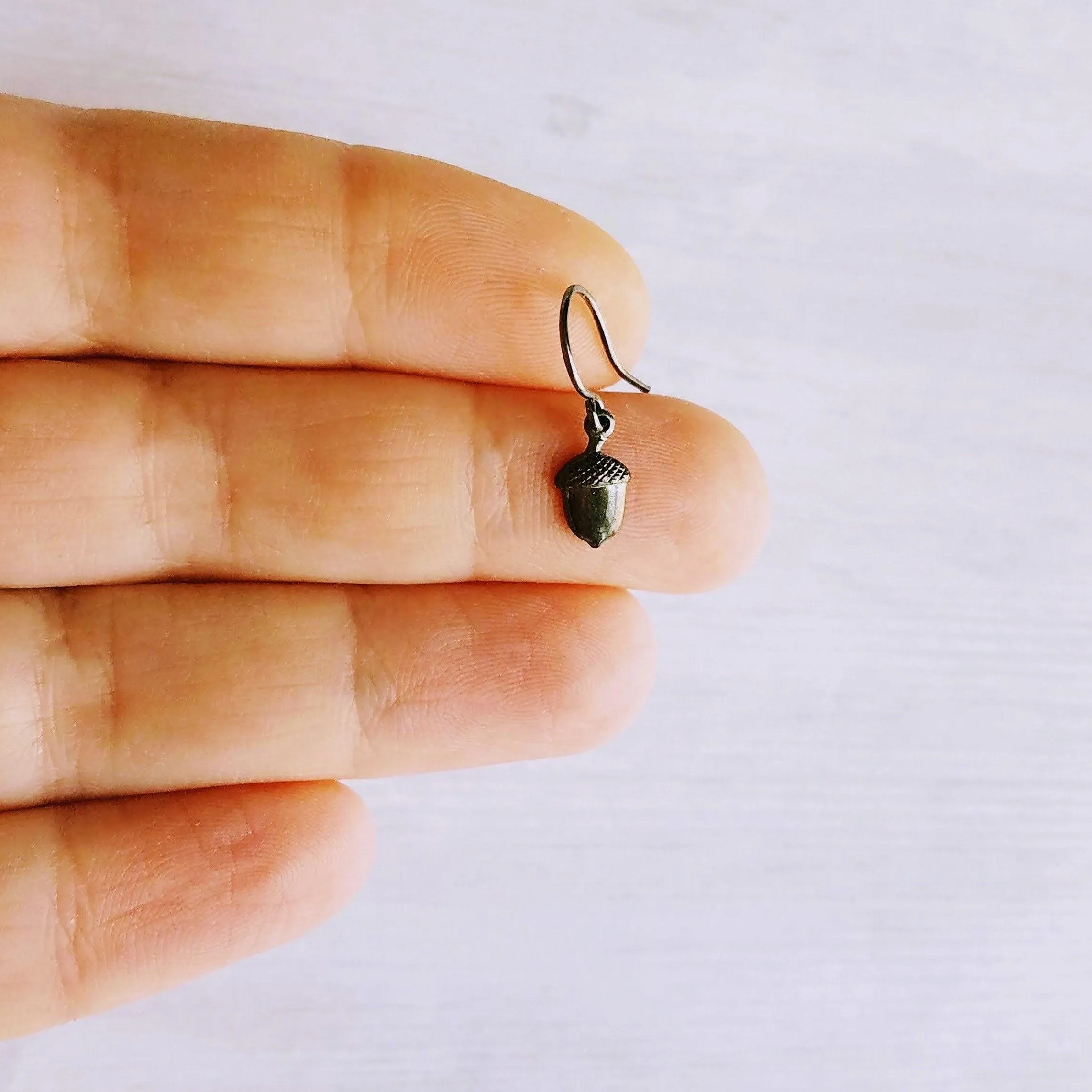 Mini Acorn Earrings - small black silver gunmetal squirrel nut charms dangle on delicate shiny little ear hooks, fall autumn jewelry