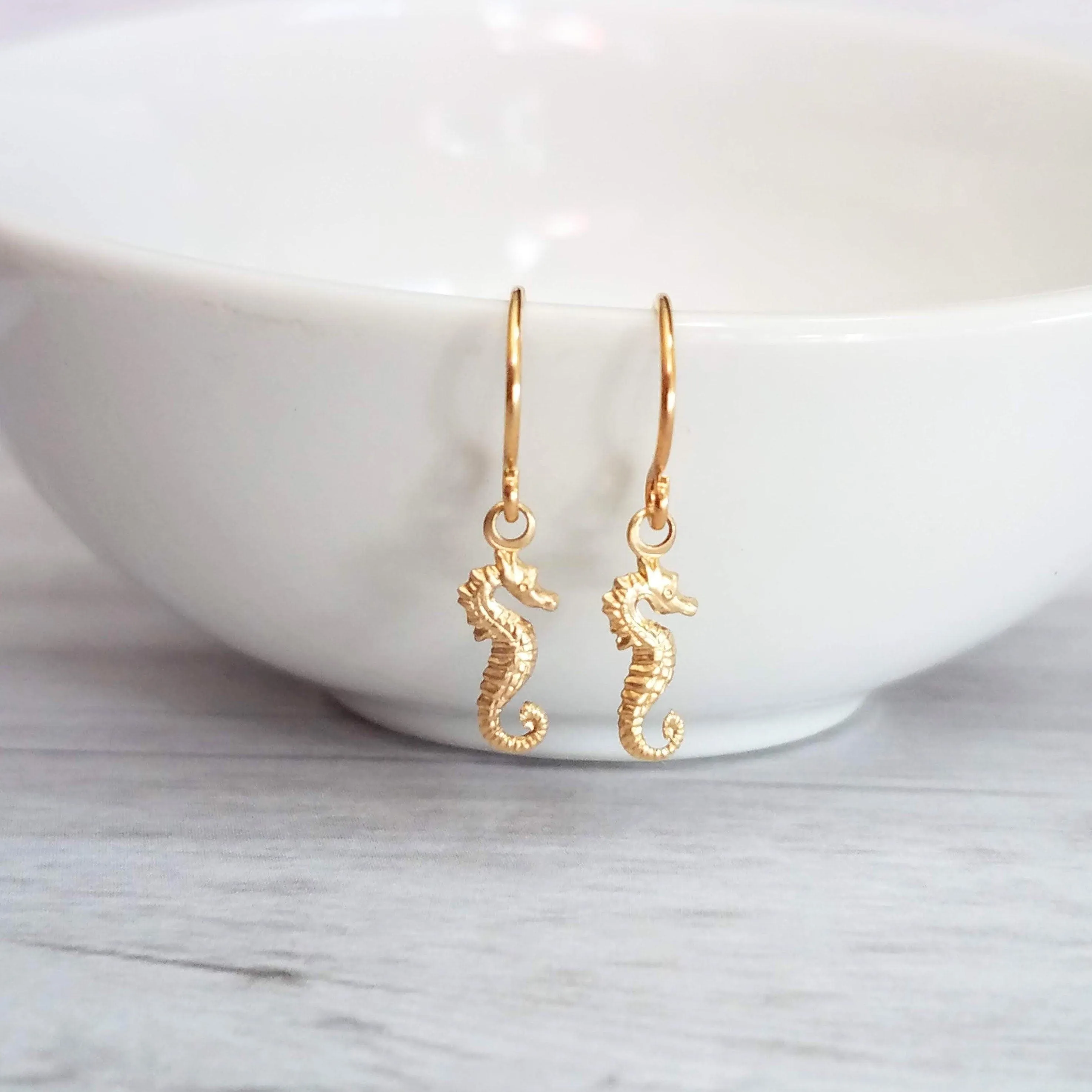 Seahorse Earrings - little tiny black gunmetal silver charms dangle on small simple shiny delicate hooks, minimalist tropical beach memento